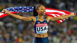 Die US-Amerikanerin Allyson Felix (M.) gewinnt bei der Leichathletik-WM 2011 in Daegu Gold mit der 4x400-Meter-Staffel. © picture alliance / dpa Foto: Kerim Okten