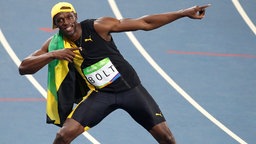 Sprinter Usain Bolt aus Jamaika feiert seinen Sieg. © dpa - Bildfunk Foto: Friso Gentsch