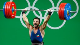 Der iranische Gewichtheber Kianoush Rostami © dpa - Bildfunk Foto: Larry W Smith