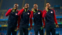 Die männliche 4x400 Meter-Staffel der USA mit Lashawn Merritt, Gil Roberts, Tony McQuay und Arman Hall (v.l.n.r.) © dpa - Bildfunk Foto: Yoan Valat