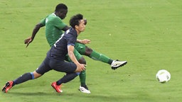 Spielszene Nigeria - Japan © picture-alliance / dpa Foto: Guido Kirchner