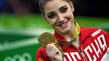 Die russische Turnerin Aliya Mustafina freut sich. © dpa Foto: Lukas Schulze