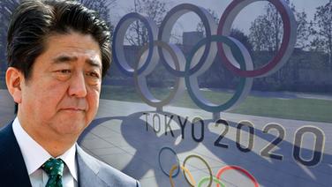 Japans Premierminister Shinzo Abe vor einem Olympia-Logo (Fotomontage) © picture alliance / SVEN SIMON 