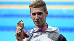 Der Bronzegewinner bei den Olympischen Spielen 2020 in Tokio Florian Wellbrock aus Deutschland
© dpa +++ dpa-Bildfunk Foto:  Swen Pförtner